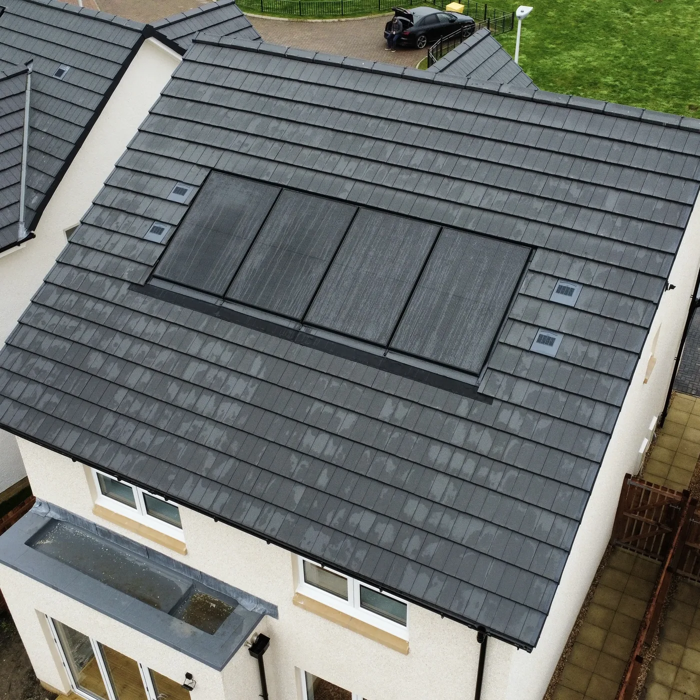 Straight-down drone photograph of a completed new build roof and solar panels